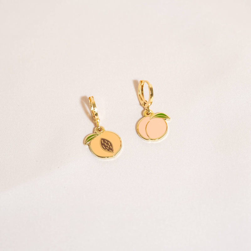 Mis-matched peach huggie hoop earrings